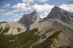 12C Two Of The Three Sisters - Charity Peak and Hope Peak From Just After Three Sisters Pass As Helicopter From Lake Magog Nears Canmore In Summer.jpg